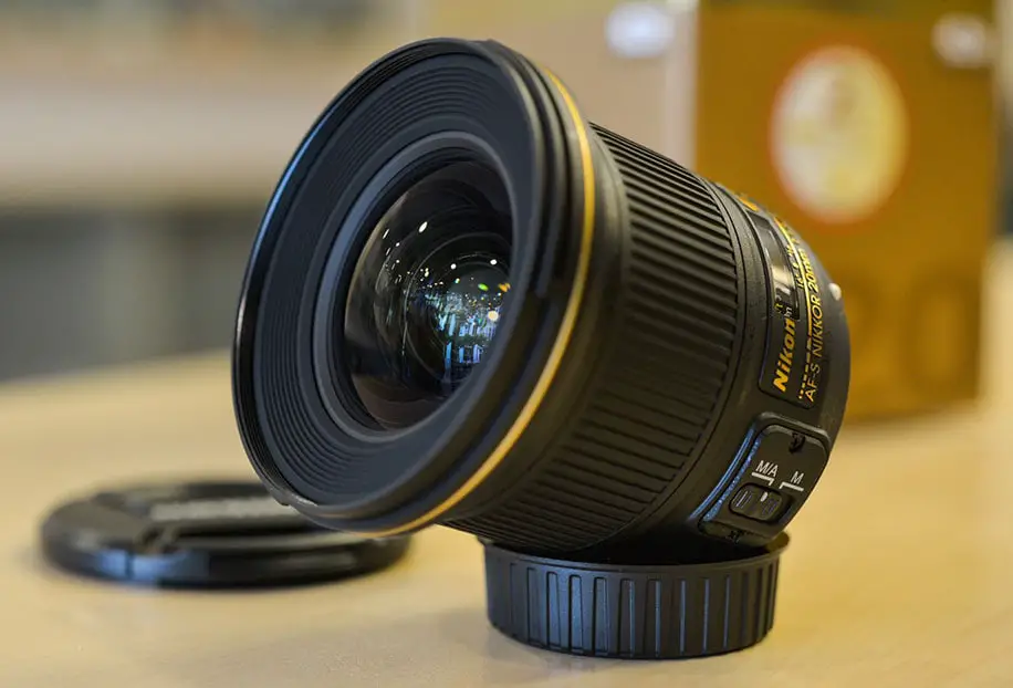 black camera lens on a brown surface