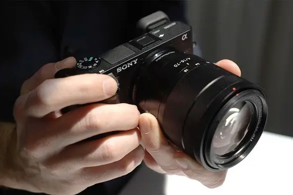 Man calibrates the lens settings on his Sony A6300 camera