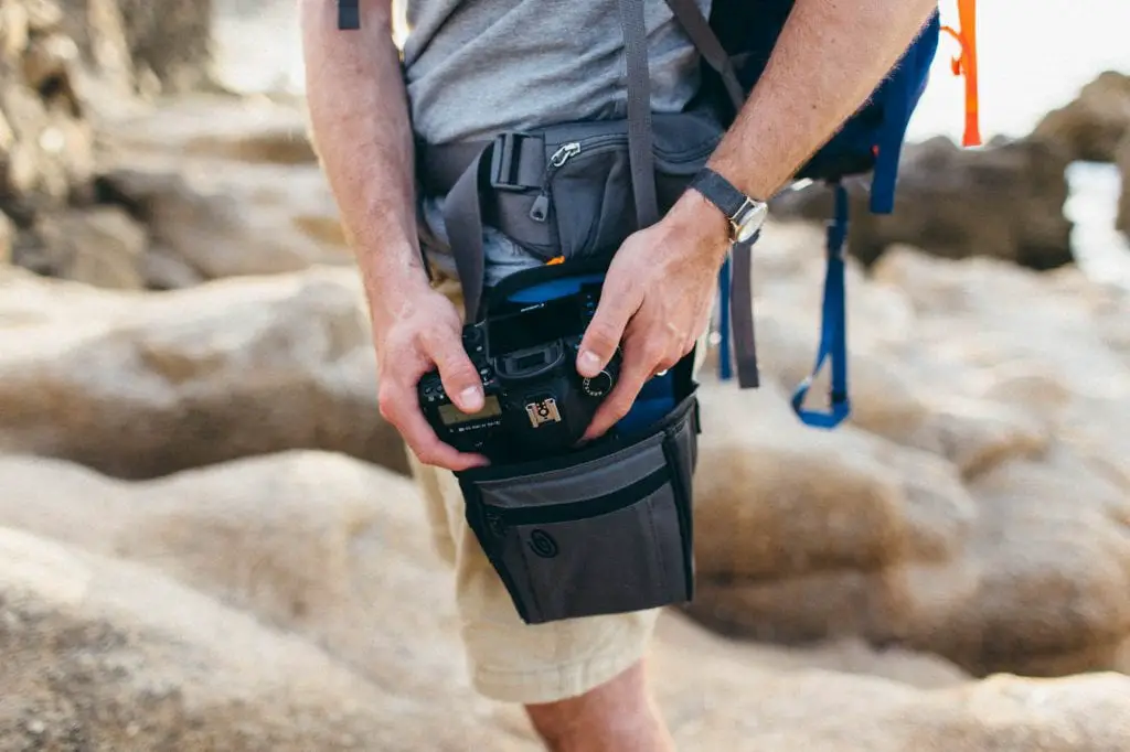 man with a belt bag on a rocky background