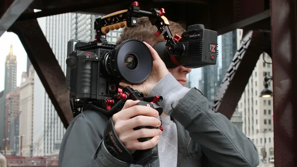 man holding a camera with rigs