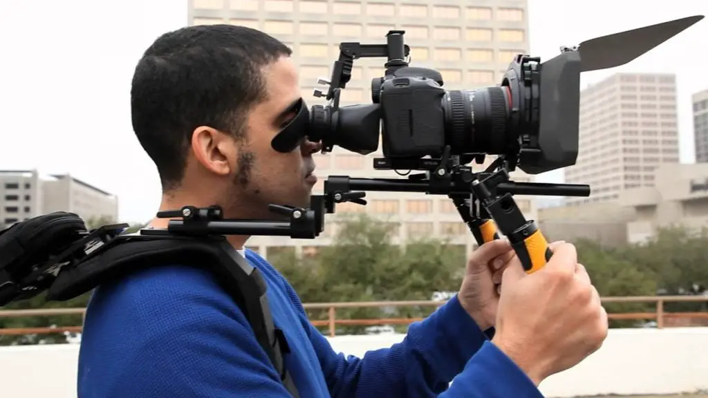 man holding camera and rigs