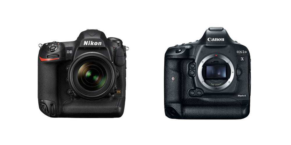 A Nikon camera beside a Canon camera