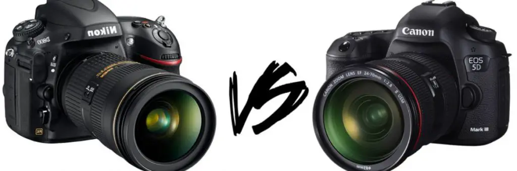 A photo showing a Canon camera being compared to a Nikon camera