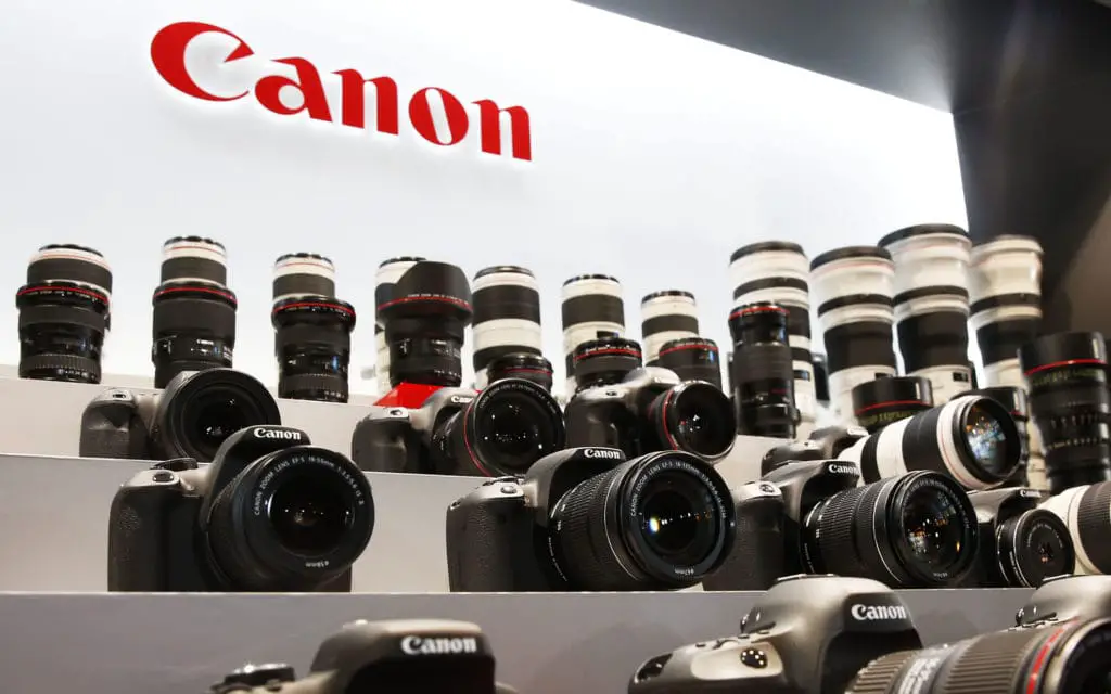 An image showing a display of different Canon cameras