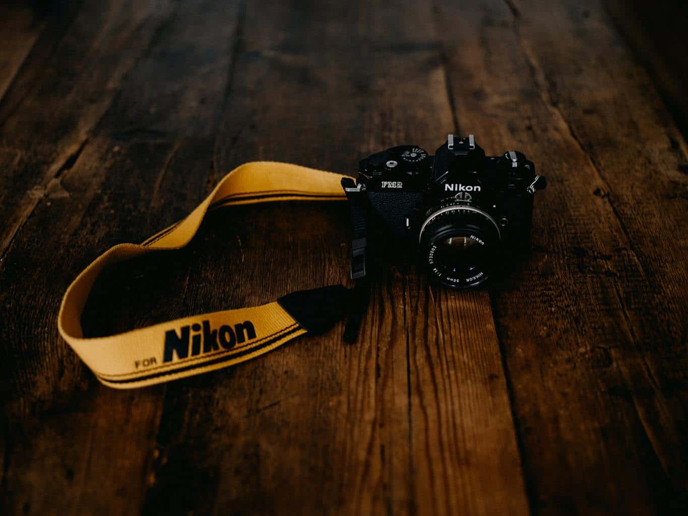 nikon d6500 on wooden table