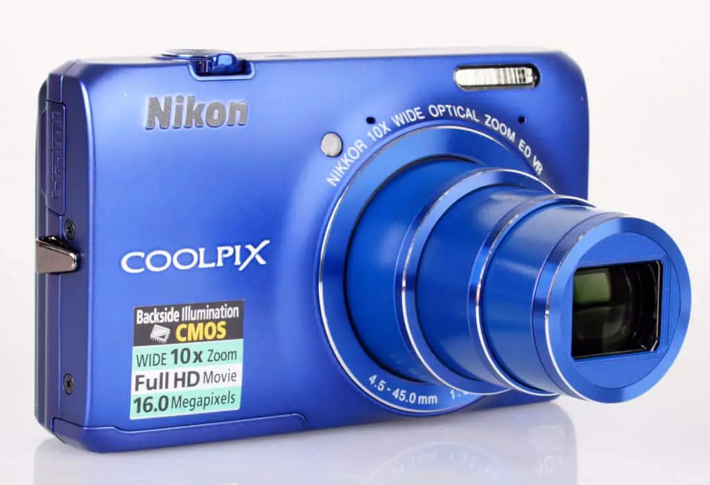 blue Nikon Coolpix S6300 camera with white background