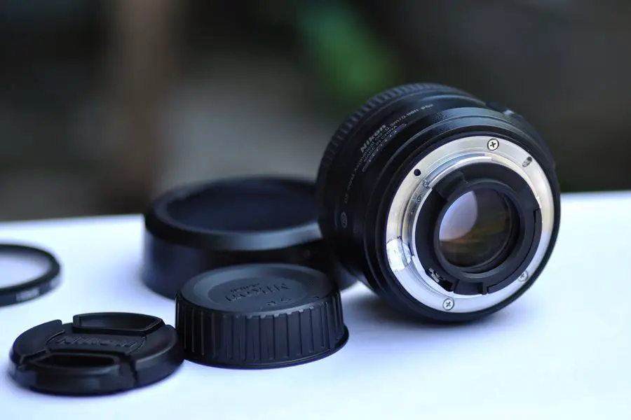 Camera lens with caps beside it