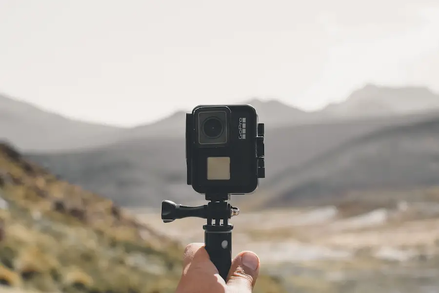 Person holding a GoPro camera