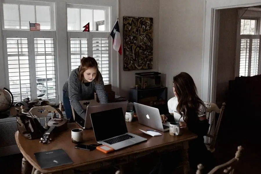 An image of women using laptop