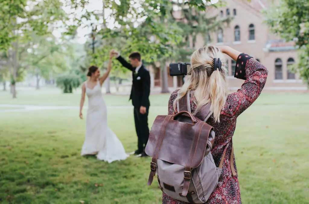 Photographer taking photo of bride and groom