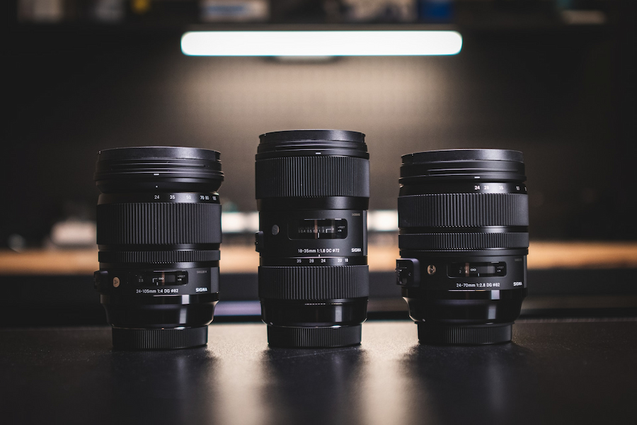 Camera lenses on a black surface