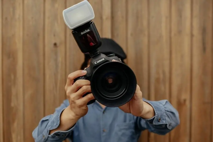 An image of a person holding a camera