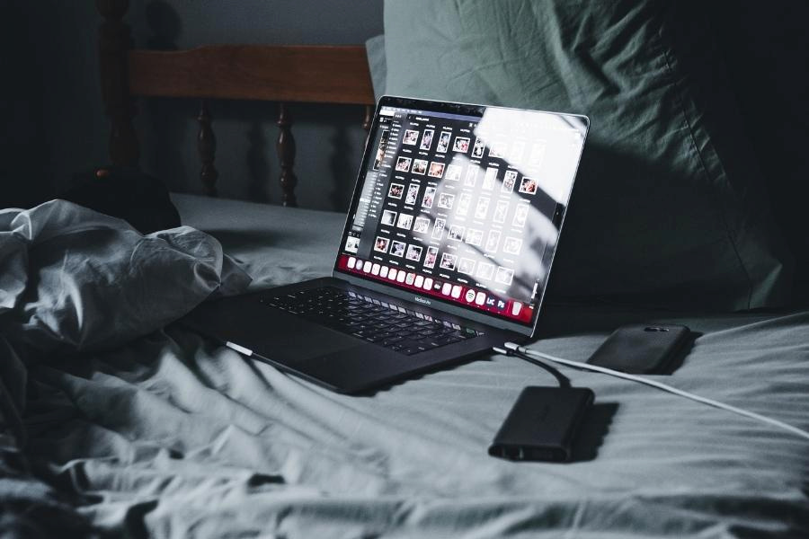 An image of Macbook on bed